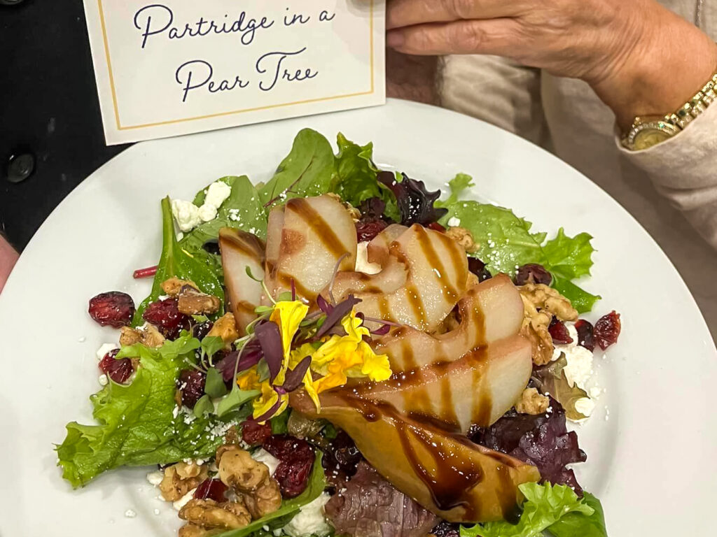 Partridge and Pear Tree Salad- Red wine poached pears, toasted walnuts, goat cheese, dried cranberries, and mixed greens with a balsamic vinaigrette.