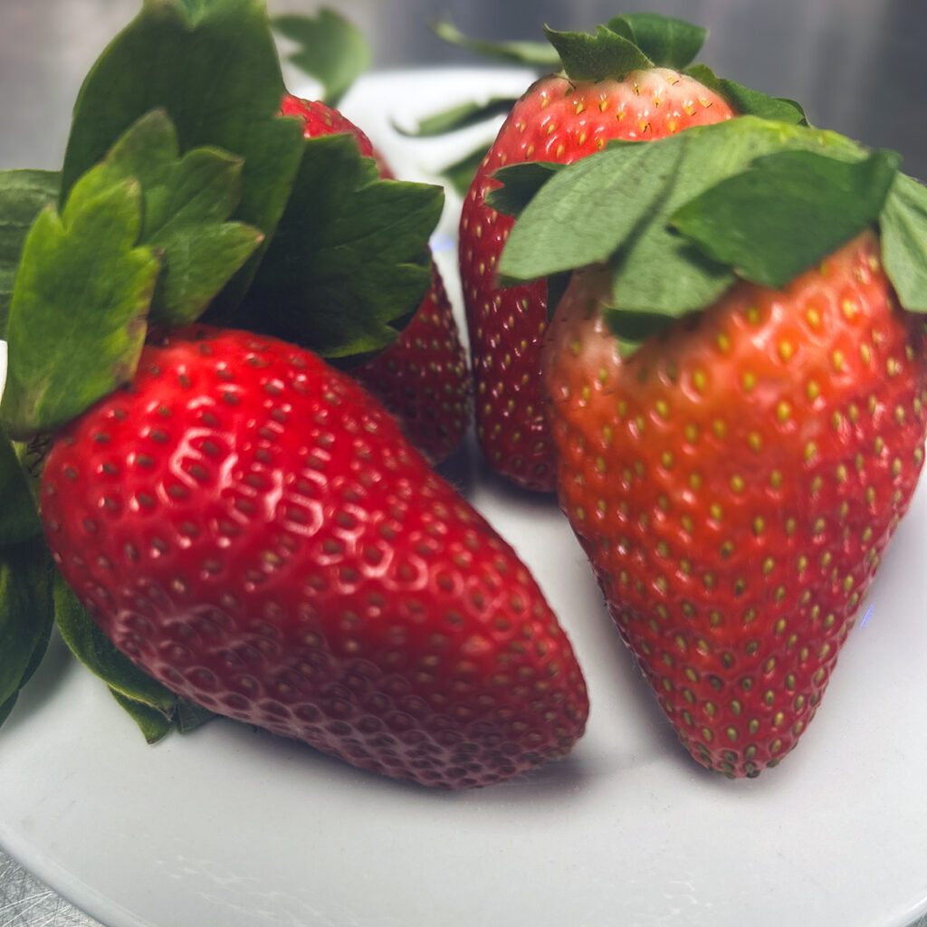 Fresh whole strawberries, ready to be used in chef-prepared dishes at Vitalia North Royalton.