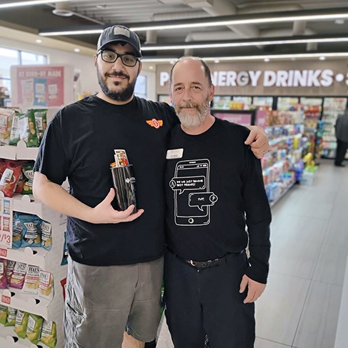 A team member from Vitalia North Royalton smiles alongside a local business owner.